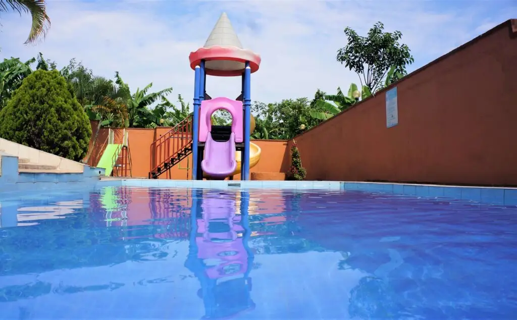 Relaxing by the pool at ATACO Country Resort, one of the hotels with swimming pools in Fort Portal.